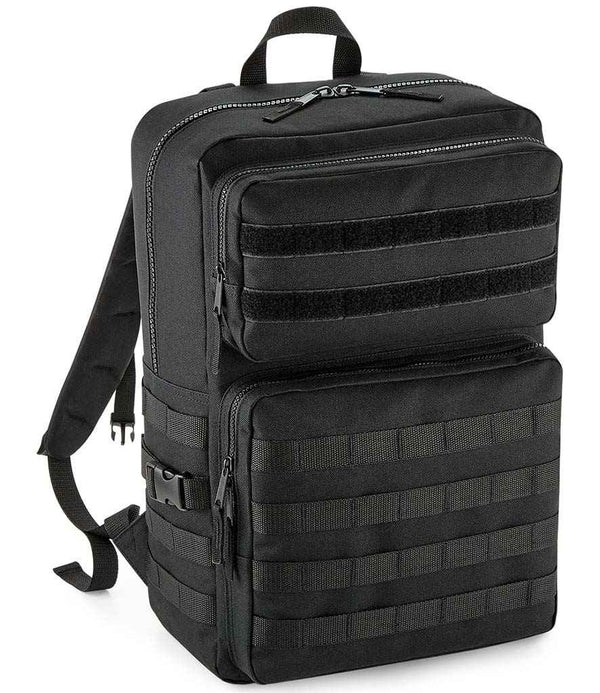 The BagBase MOLLE Tactical Backpack by BagBase is black, made from recycled polyester, and features multiple zippered compartments, adjustable shoulder straps, military-style webbing for gear attachment, and a top carry handle.