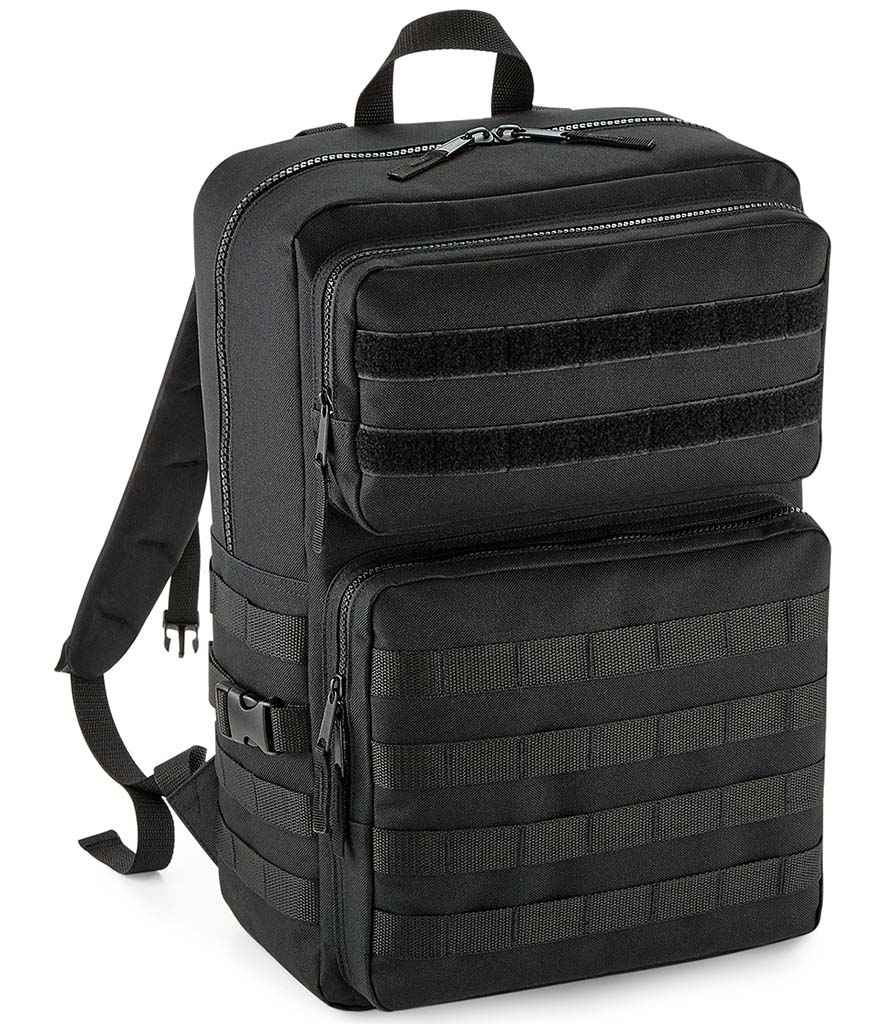 The BagBase MOLLE Tactical Backpack by BagBase is black, made from recycled polyester, and features multiple zippered compartments, adjustable shoulder straps, military-style webbing for gear attachment, and a top carry handle.