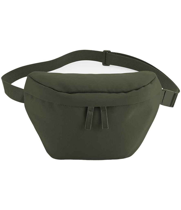 The BagBase Simplicity Waistpack by BagBase is a dark green, minimalist fanny pack made from water-repellent fabric, featuring a zippered main compartment and adjustable buckle strap. Shown on a white background.