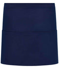 The Brand Lab Organic/Recycled Waist Pocket Apron is a plain, dark blue chef apron with three front pockets, made from easy-care fabric by Brand Lab and shown against a white background.