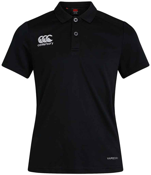 The Canterbury Ladies Club Dry Polo Shirt is a black short-sleeve polo with a ribbed collar, three buttons, Canterbury logo on the right chest, VAPODRI on the lower left, and advanced Vapodri technology for moisture management.