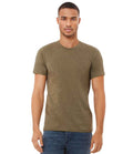 A man stands facing forward against a plain white background wearing a Bella+Canvas Canvas Unisex Heather CVC T-Shirt in olive green with a ribbed collar and blue jeans.
