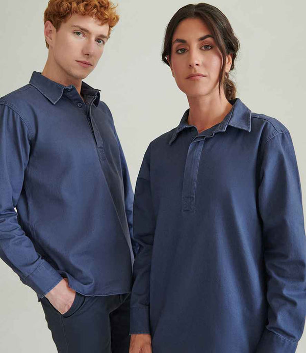 Two people wear Front Row Pullover Drill Shirts—long-sleeved, blue collared shirts with shaped hems. One has short curly hair and a hand in their pocket; the other has long dark hair pulled back. Brand: Front Row.