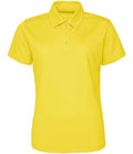The Just Cool AWDis Ladies Cool Polo Shirt is a plain yellow, short-sleeve collared top with three buttons, made from recycled polyester for eco-friendly style, shown on a white background.