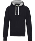 The Just Hoods AWDis Chunky Hoodie is a black, long-sleeve hoodie with a gray inner lining, white drawstrings, double fabric hood, and cotton faced fabric. It appears unworn and is shown on a plain white background.
