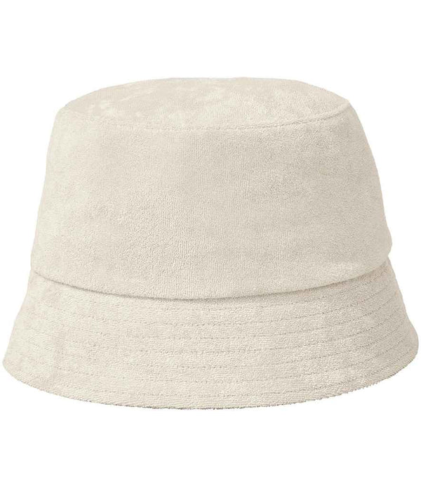 The Native Spirit Terry Towel Bucket Hat by Native Spirit, shown against a white background, features a plain off-white design with textured towelling fabric, a simple round crown, and a downward-sloping brim.