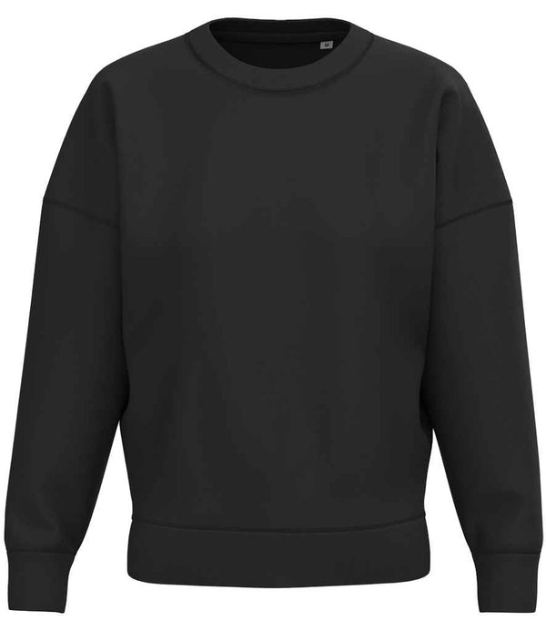 The Native Spirit Ladies Crew Neck Sweatshirt by Native Spirit features long sleeves, a relaxed oversized fit, and soft brushed back fleece, shown in plain black against a white background.