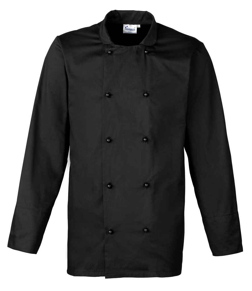 The Premier Unisex Cuisine Chefs Jacket by Premier is a black, long-sleeved chef jacket with a mandarin collar and double-breasted front, featuring black stud button closure, shown on a plain white background.