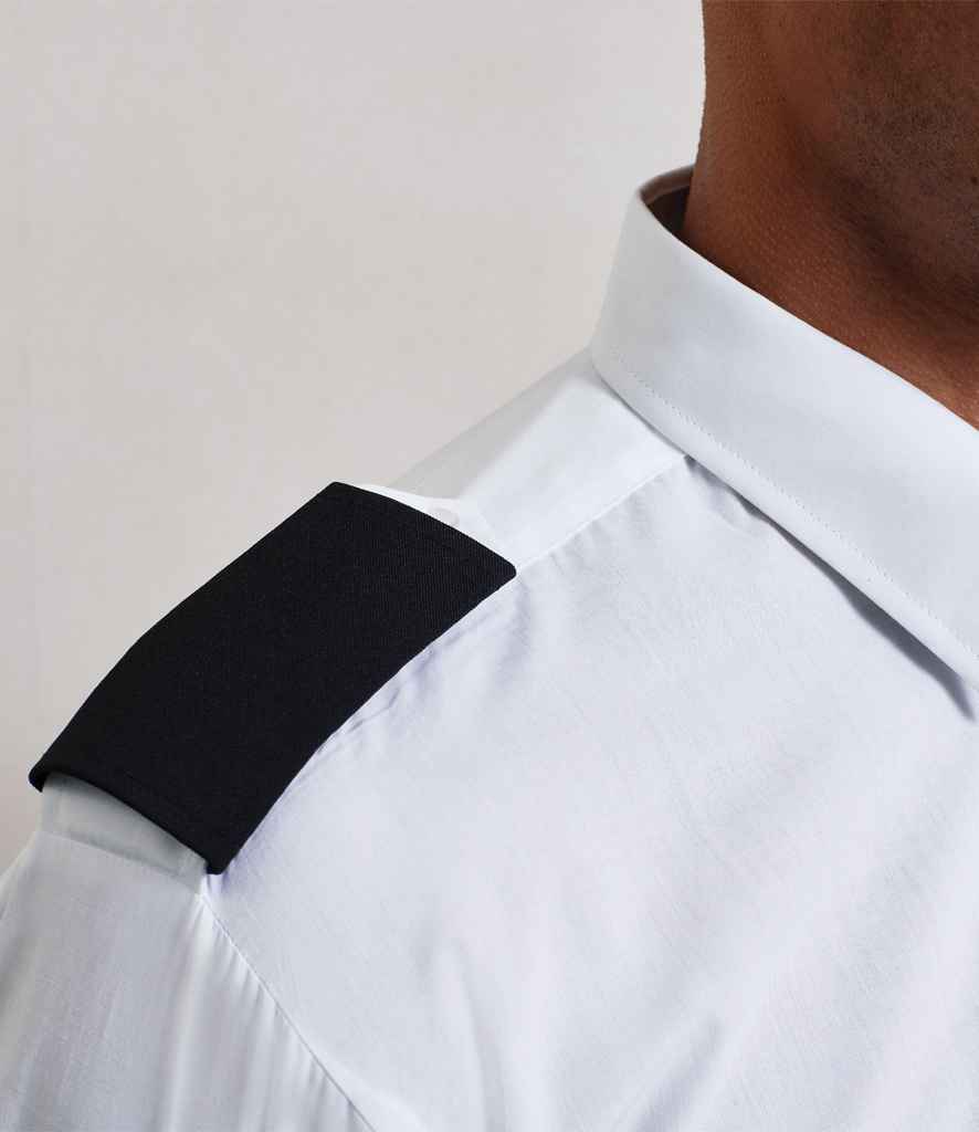 A close-up shows a person wearing a Premier white collared shirt with Premier Epaulettes featuring an embroiderable black shoulder patch. Only the neck, shoulder, and upper chest are visible.