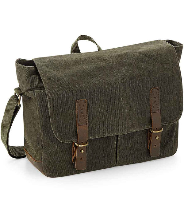The Quadra Heritage Waxed Canvas Messenger Bag features green canvas with real leather trim, brown straps, a flap closure, adjustable shoulder strap, two front pockets, a top handle, and is laptop compatible. Brand: Quadra.
