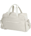 The Quadra Airside Weekender by Quadra is a light beige travel duffle with two short handles, an adjustable shoulder strap, roomy main compartment, front zippered pocket, and is airline overhead cabin compatible—shown on a white background.