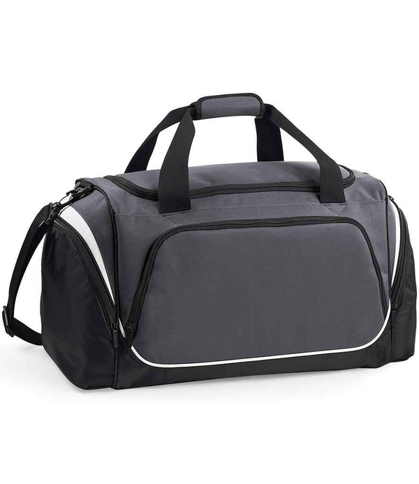 The Quadra Pro Team Locker Bag by Quadra is a gray and black rectangular sports gym bag featuring two short handles, an adjustable shoulder strap, multiple zip compartments, a shoe tunnel, and white trim for added style.