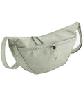 The Quadra Studio Cross Body Bag by Quadra is a light sage green bag featuring an adjustable strap, main zip compartment, and large front pocket with button closure—a minimalist design ideal for everyday essentials.