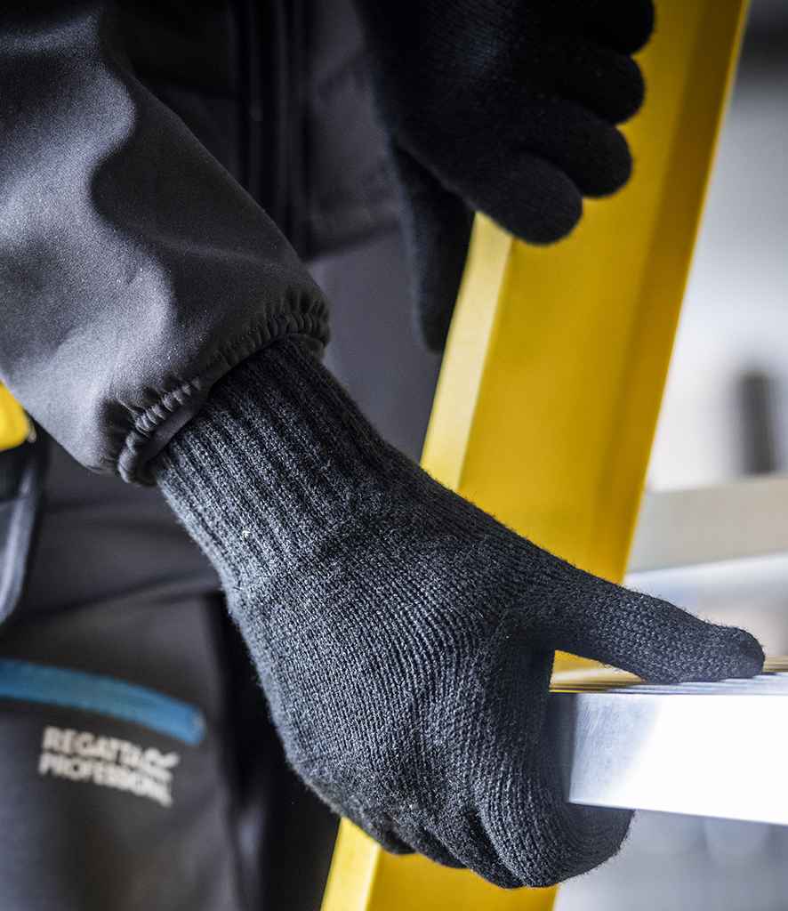 A person wearing Regatta Knitted Gloves by Regatta Professional grips a yellow ladder with one hand and a silver horizontal bar with the other; part of their dark jacket sleeve and pocket are visible.