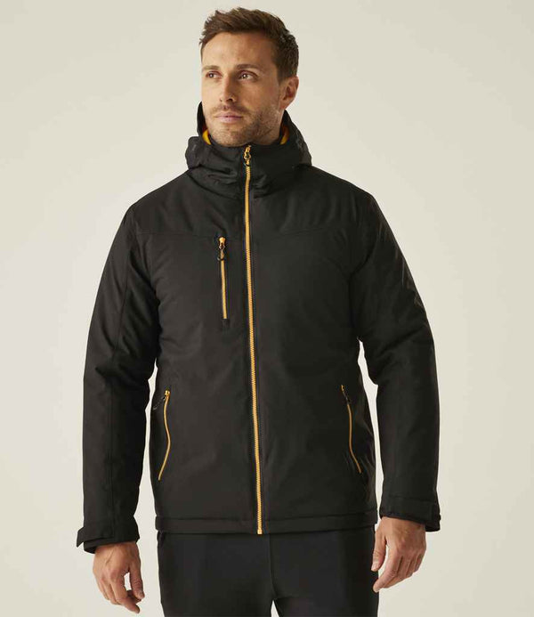 A man faces forward against a plain background, wearing the Regatta Navigate Waterproof Insulated Jacket by Regatta Professional in black with yellow zippers and matching pants, featuring breathable recycled insulation for comfort and sustainability.