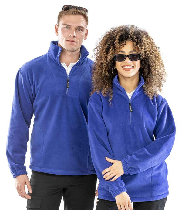 A man and a woman wearing Result Polartherm™ Zip Neck Fleece pullovers with sunglasses stand side by side against a white background.
