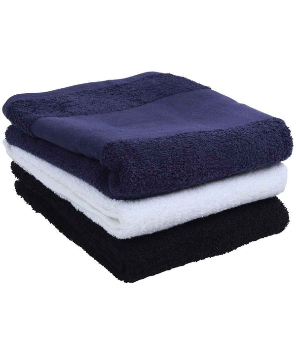 A stack of Towel City Printable Border Hand Towels by Towel City in dark blue, white, and black features thick pile terry towelling and a flat weave border for excellent absorbency on a plain surface.