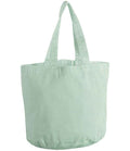 The Westford Mill Garment Dyed Shopper is a plain light green recycled cotton tote with two handles, no visible logos or pockets, and a spacious 29-litre oval base—perfect for everyday use. Shown against a white background. Brand: Westford Mill.