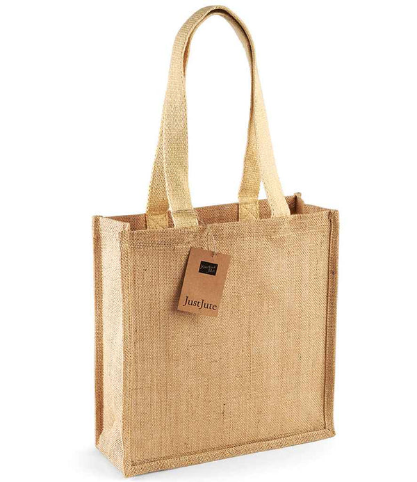 The Westford Mill Jute Compact Tote Bag is a rectangular jute tote with cotton shoulder straps, a brown Just Jute tag, and a 10-litre capacity. The empty bag is shown against a white background. Brand: Westford Mill.