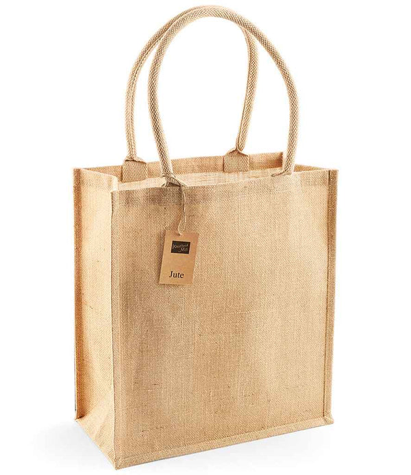 The Westford Mill Jute Boutique Shopper is a rectangular jute tote with sturdy cotton handles, a Jute tag, and a 19L capacity—perfect for daily essentials by Westford Mill. Stands upright on a white background.