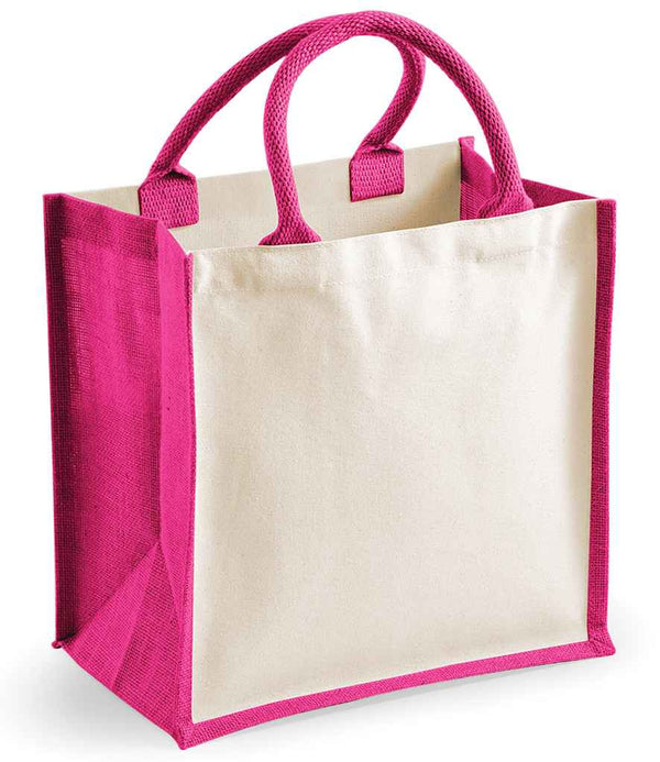 The Westford Mill Printers Midi Jute Tote Bag by Westford Mill features cream panels with bright pink sides and handles, durable canvas side panels, and sturdy cotton carry handles. Its rectangular shape stands upright on a white background.