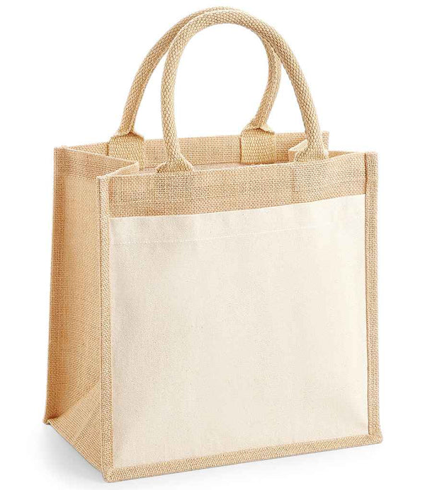 The Westford Mill Pocket Jute Midi Tote Bag by Westford Mill is a beige cotton canvas tote with sturdy jute sides, cotton handles, a large cream front pocket, and 14L capacity. It stands upright on a white background.