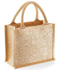 The Westford Mill Shimmer Jute Mini Gift Bag by Westford Mill is a beige tote with cotton handles, a glittery gold front, and a rectangular upright shape. It holds 6 litres—perfect for daily essentials and stands out on any occasion.