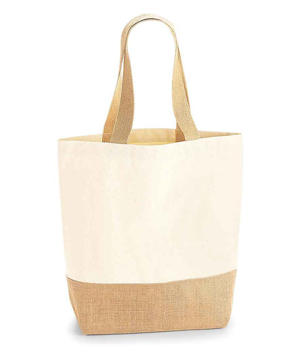The Westford Mill Jute Base Canvas Shopper features a two-tone design with an off-white upper, light brown jute base, beige cotton webbing straps, and premium heavyweight fabric. It stands upright on a plain white background.