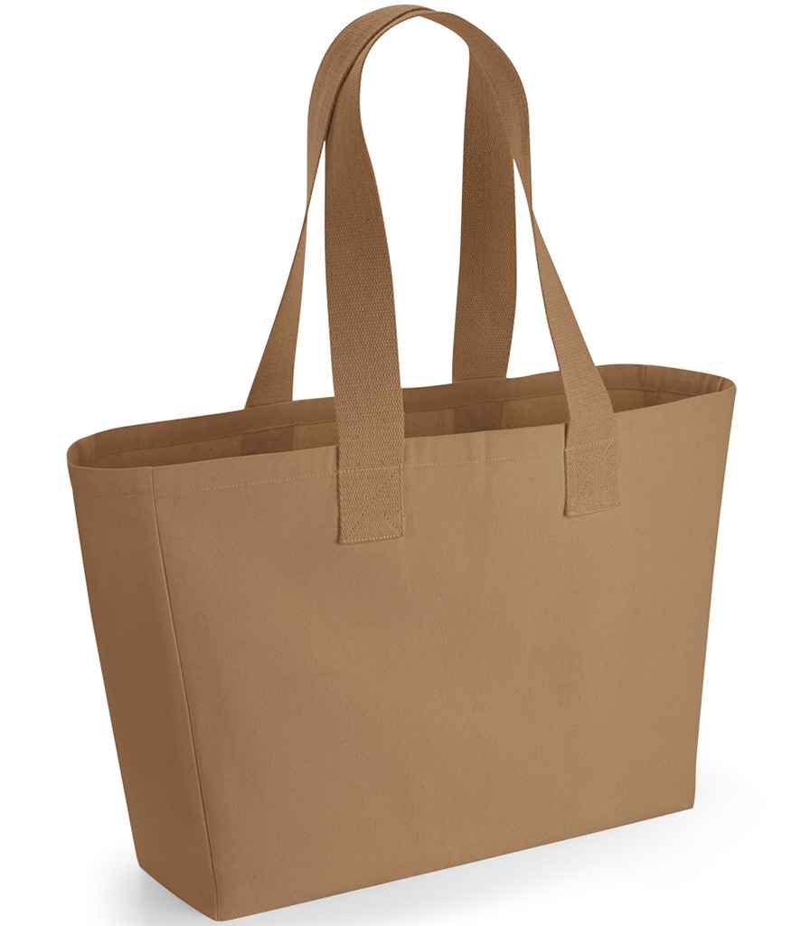 The Westford Mill Everyday Canvas Tote Bag by Westford Mill is a plain light brown tote with a 24L capacity and two sturdy shoulder straps, featuring a simple, unadorned design and shown standing upright against a white background.