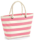 The Westford Mill Nautical Beach Bag by Westford Mill features pink and white stripes, rope shoulder straps with metal grommets, and a spacious 22L capacity—perfect for carrying your essentials.