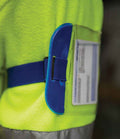 A close-up of the Yoko ID Arm Band by YOKO in high-visibility yellow with a reflective strip. An elastic strap secures an ID pocket on the sleeve, holding a partially visible card for convenient access and identification.